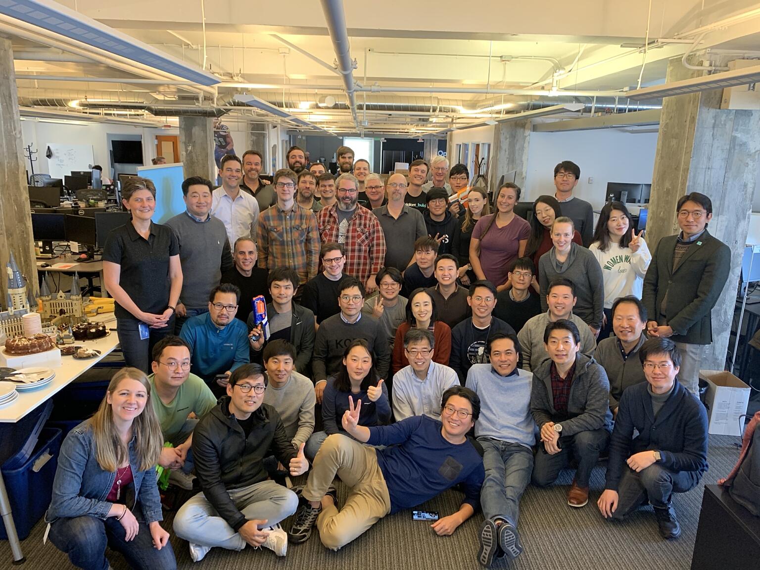 Large group of LG and Slalom Build builders together during an office event.