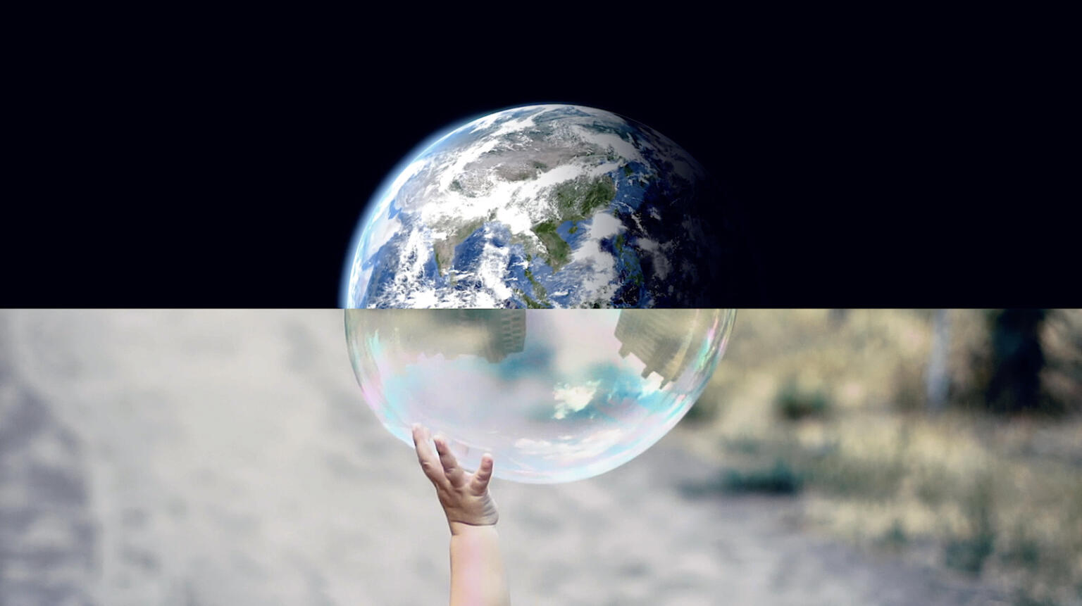 Photo composition: Earth from space on top, bubble with child's hand reaching on bottom.